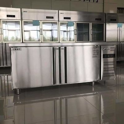 Stainless steel commercial refrigerator workbench in the back kitchen of hotel restaurant